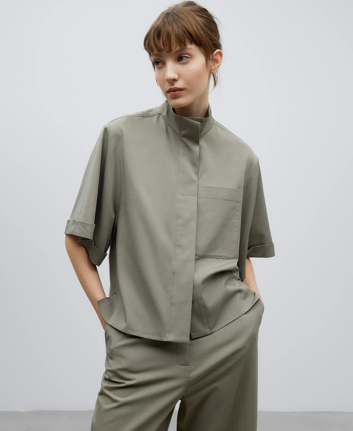 Grey high collar shirt woman